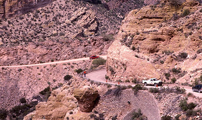 Photograph of a road crew working near a section of the Apache Trail’s historical stone wall